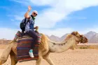 Egypt tour featuring Marsa Alam quad biking and sunset camel rides in the desert.